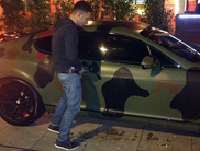 Footbal fan takes a leak on Mario Balotelli's car