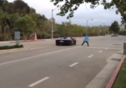 Man throws rock on a Lamborghini Aventador