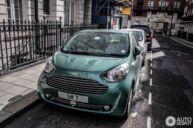 Stirling Moss takes it easy: cruising around in an Aston Martin Cygnet