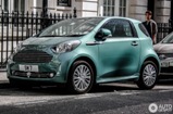 Stirling Moss takes it easy: cruising around in an Aston Martin Cygnet